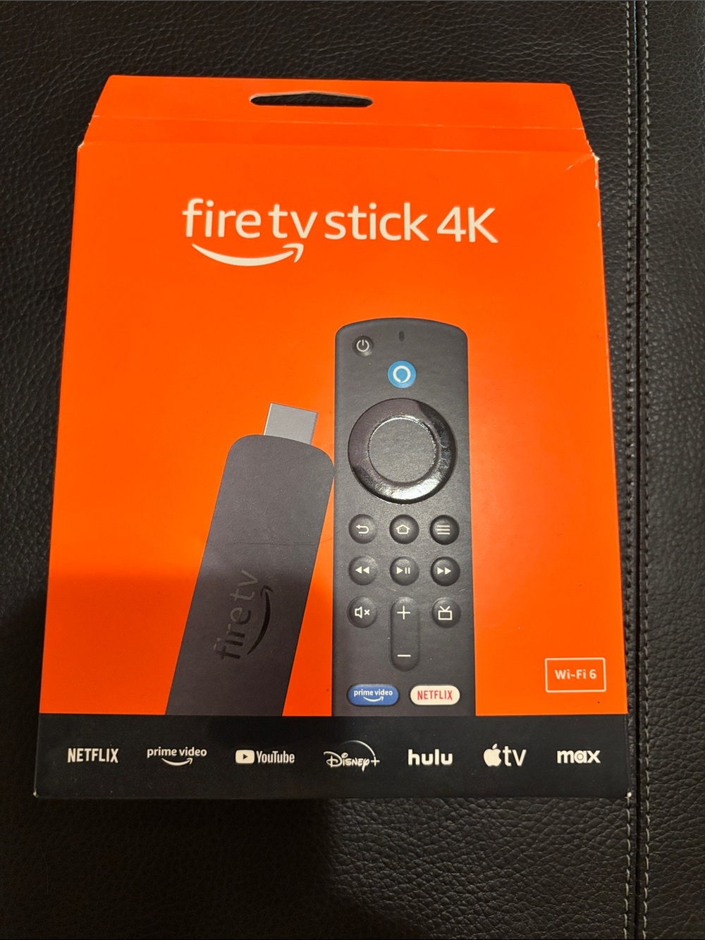 Amazon Fire TV Stick 4K - Orange Box with Black Device